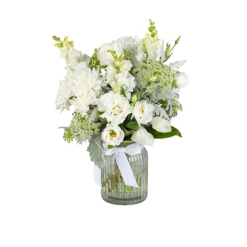loved one. This sympathy flower bouquet features a range of fresh white flowers, including white...