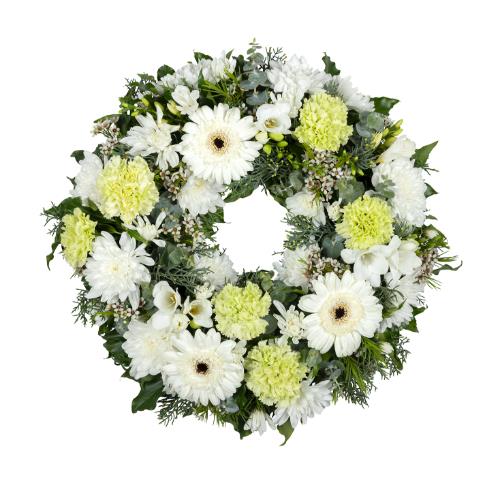 
	This white flower cluster wreath features classic flowers in white, pale green, and mid green tones...