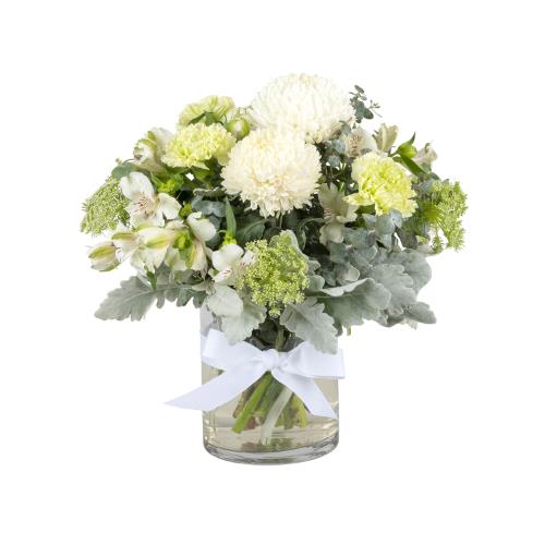 
	Embrace the timeless beauty of white flowers with this stunning bouquet arranged in a sleek glass...