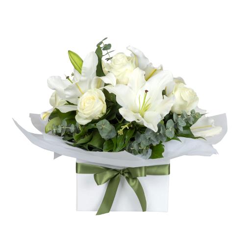 
	Surprise a loved one with White Florals. Featuring white oriental lilies, white roses and sim...