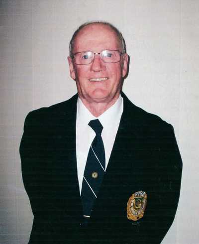 BUZZA, Arnold Thomas