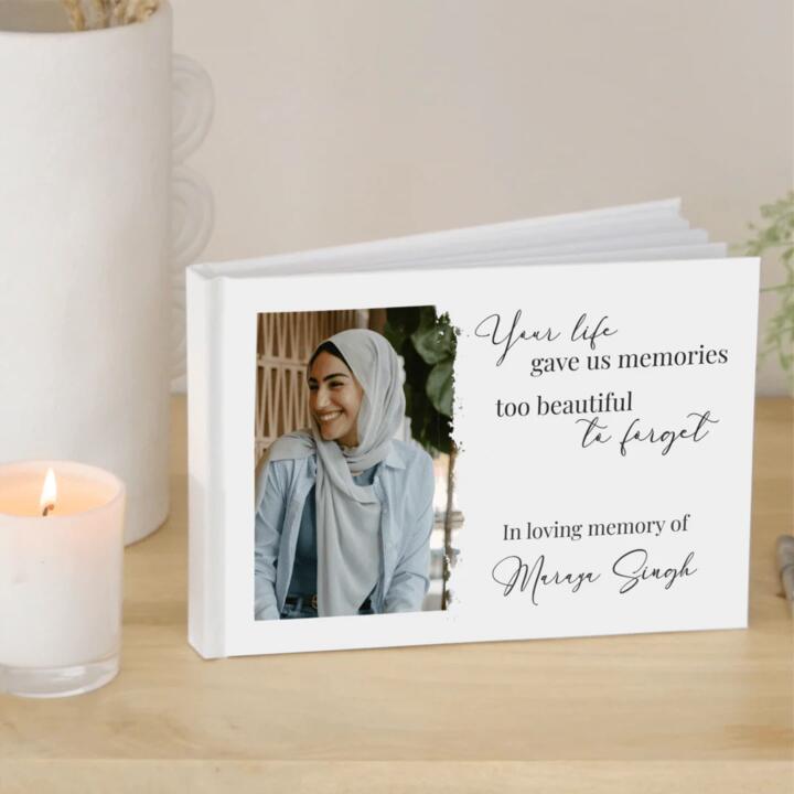 Honour a life beautifully lived with this elegant personalised Funeral Guest Book, thoughtfully...
