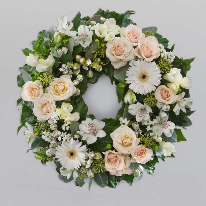 The "Serenity Wreath" is a beautifully crafted wreath designed to convey a sense of peace and...