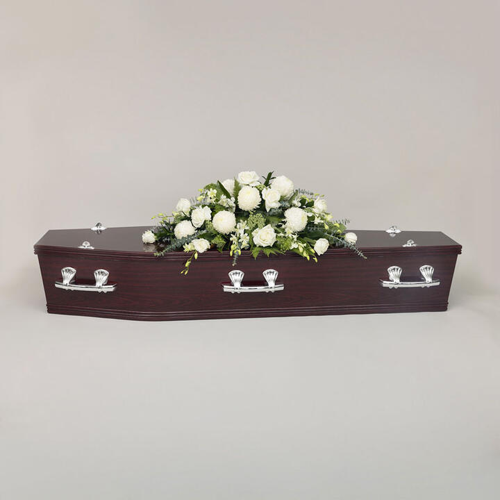 Simple Casket Flowers offers a serene and elegant tribute adorned with a selection of blooms. This...