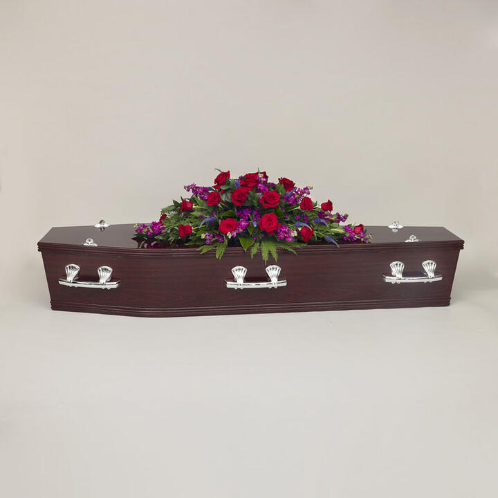 Seasonal Casket Flowers offers a vibrant and heartfelt tribute adorned with a rich assortment of...