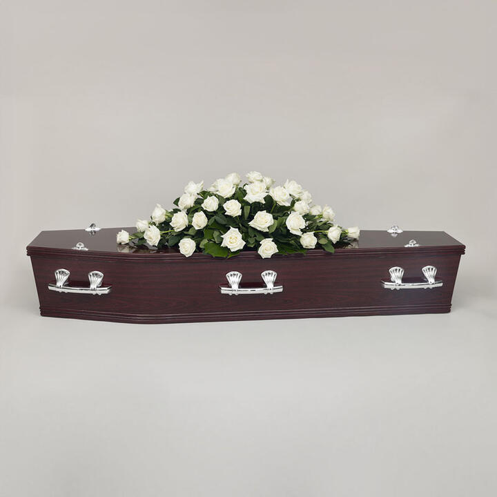 Simple Funeral Roses offers a serene and elegant tribute. This arrangement features delicate white...