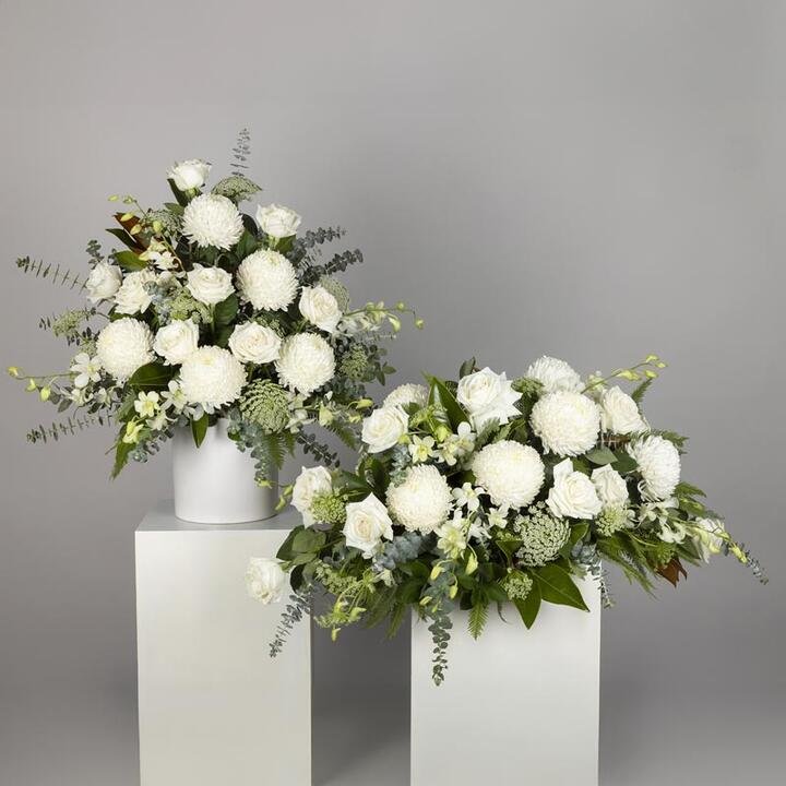 The Simple Funeral Flower Display offers a serene tribute combining flowers for a Premium Casket...