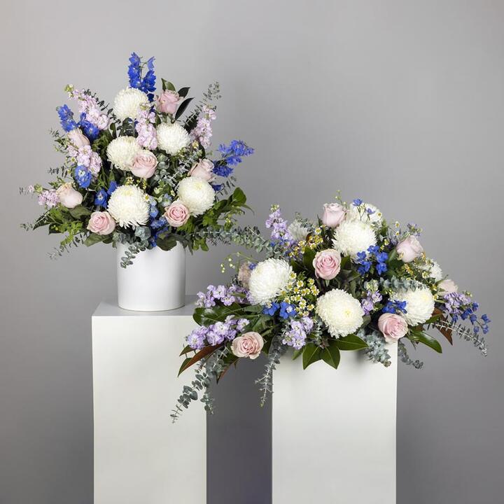 The Pastel Funeral Flower Display offers a heartfelt tribute combining both Premium Casket Flowers and...