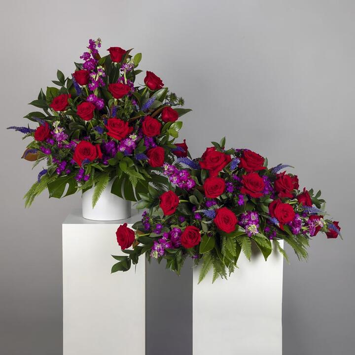 Honour the memory of your loved one with Red Funeral Flower Display, a striking tribute duo designed...