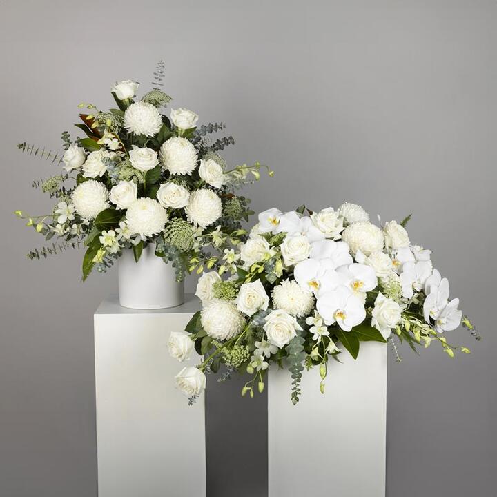 Honour your loved one with the Premium White Flower Funeral Display, a luxurious tribute ensemble for...