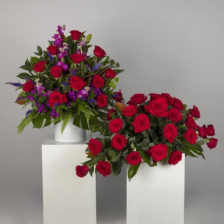 Honour the memory of your loved one with the Red Rose Funeral Display, a comprehensive tribute ensemble...