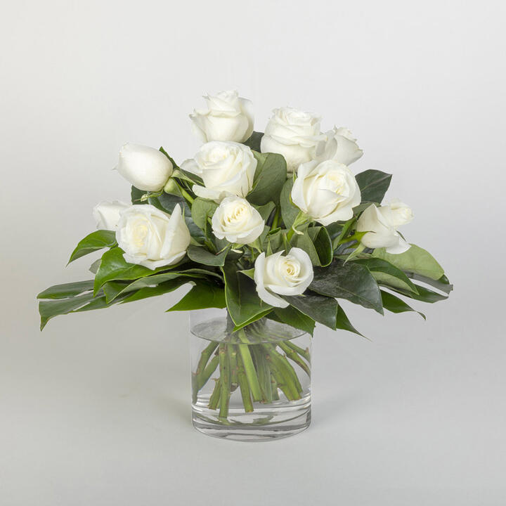 Wow your loved one with this gorgeous rose bouquet in a vase. Eternal Roses features 12 stunning white...