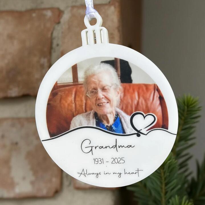 Personalised 75mm white acrylic memorial photo ornament with “Always in My Heart” design. Includes...