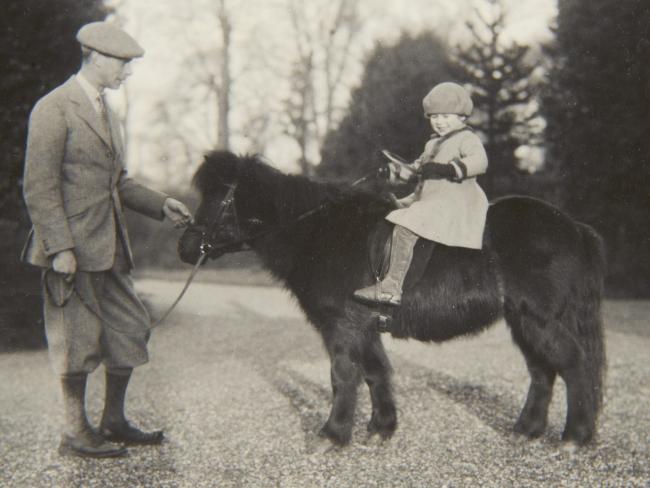 Queen Elizabeth as a child: Pictured with the Duke of York, Princess Elizabeth sits on a shetland pony.