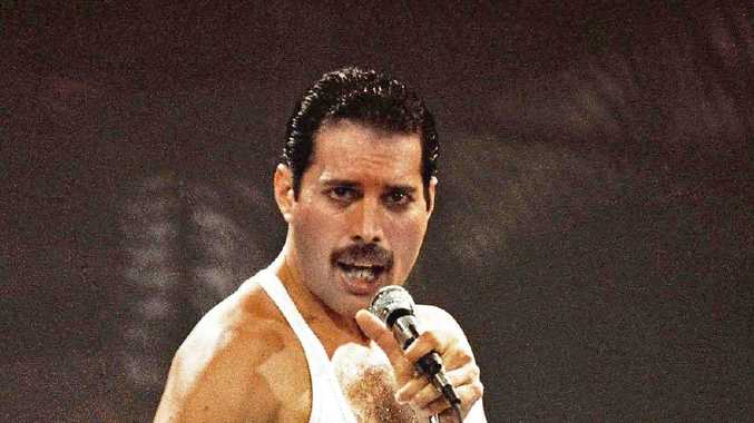 Freddie Mercury of Queen performs on stage at Live Aid at Wembley Stadium, London.