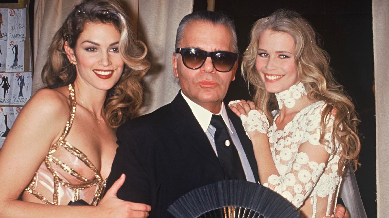 Cindy Crawford, Karl Lagerfeld and Claudia Schiffer, during the Chanel fashion show in Paris, 1993. Picture: Rindoff Petroff/Castel/Getty Images