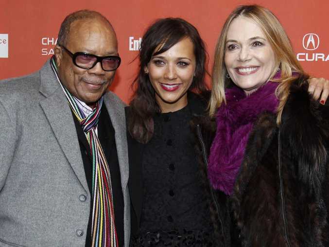 Actress Rashida Jones, centre, poses with her father Quincy Jones, left, and her mother Peggy Lipton, right. Picture: AP Photo/Danny Moloshok.