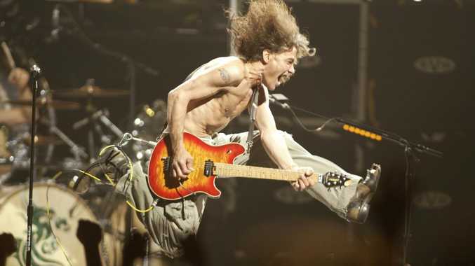 Eddie Van Halen plays the final chord of "Jump" during a Van Halen concert in 2004. Picture: AP Photo/The Star Ledger, John Munson