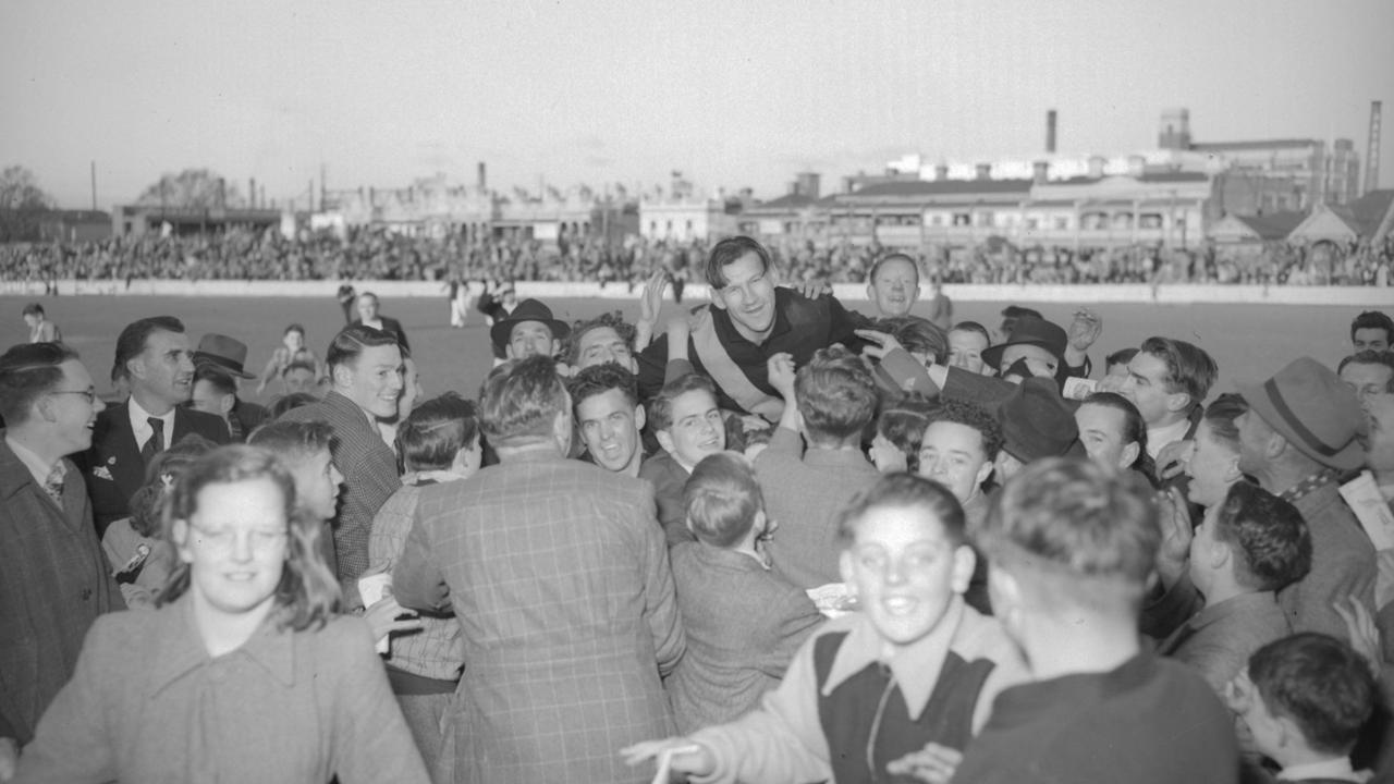 Jack Dyer being chaired off the ground after his final game at Punt Road Oval in 1949.