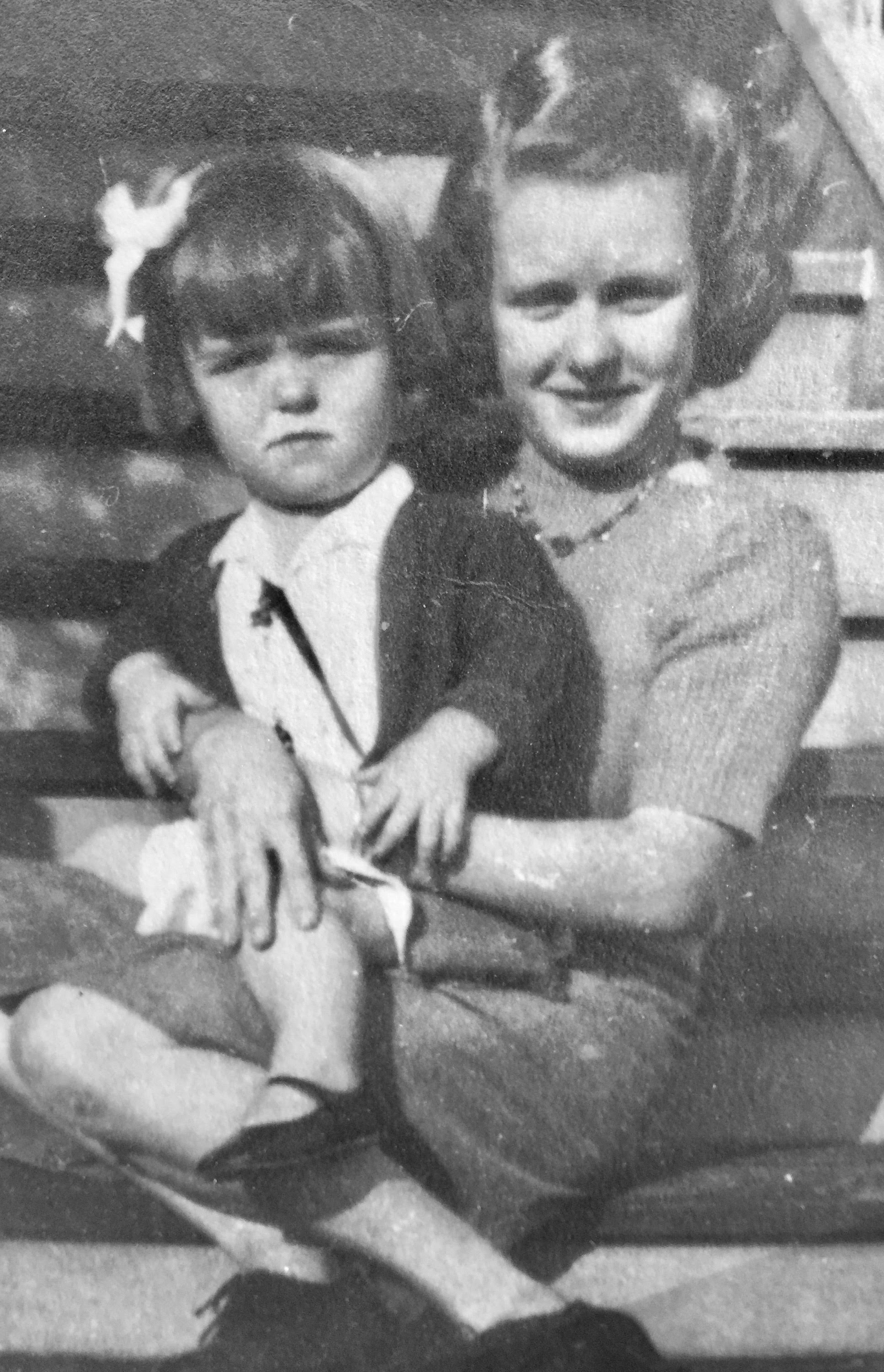 Carmel as a child with her older sister Kathleen.