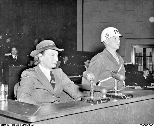 Captain Nurse Vivian Bullwinkel sitting in a witness stand, giving evidence before the War Crimes Tribunal.
