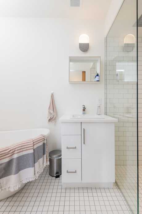 Small changes to lighting or fixtures can make an old bathroom feel new. 