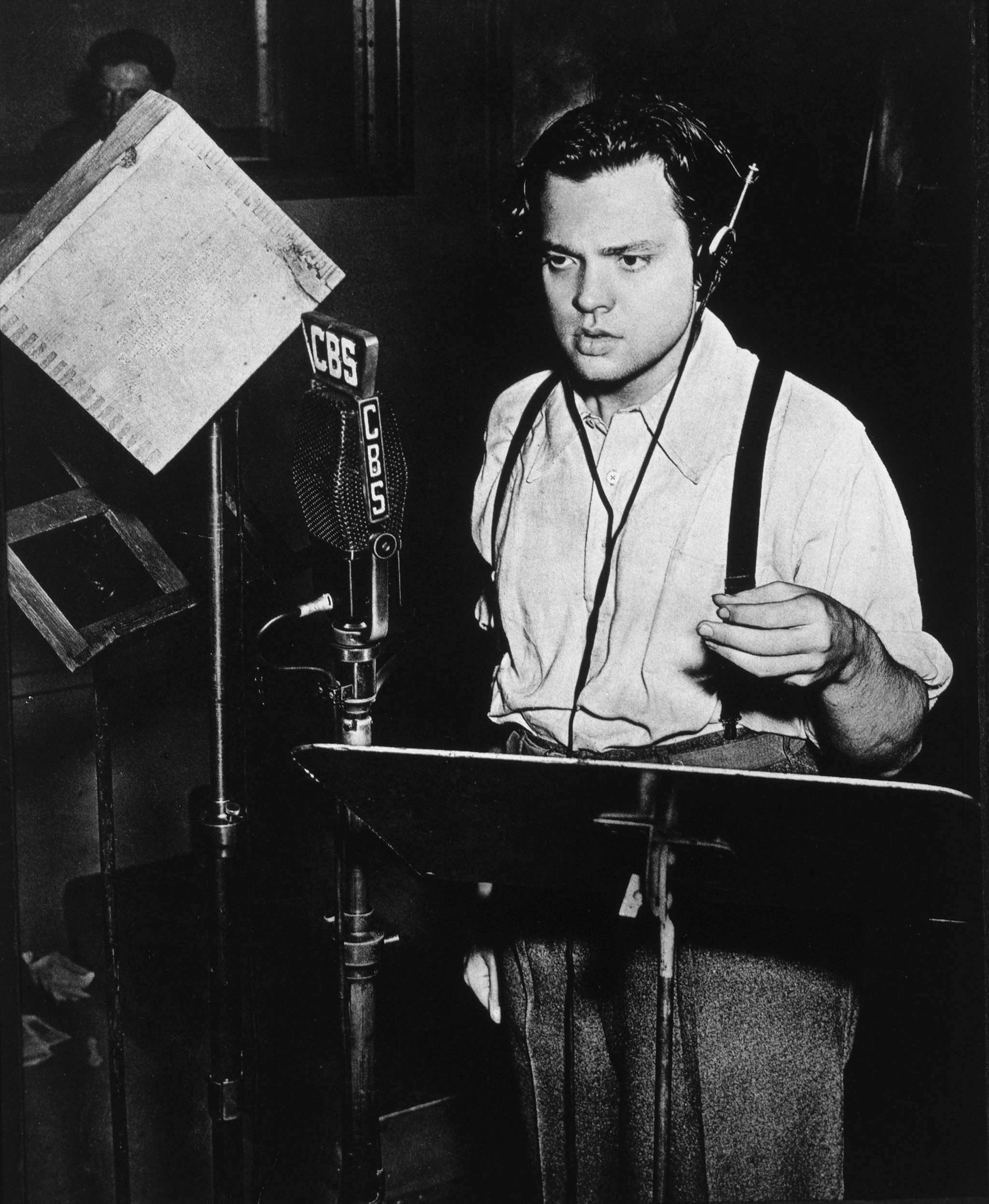 Orson Welles at work in the CBS Radio studio. Photo care of Dallas Dispatch-Journal, October 31, 1938.