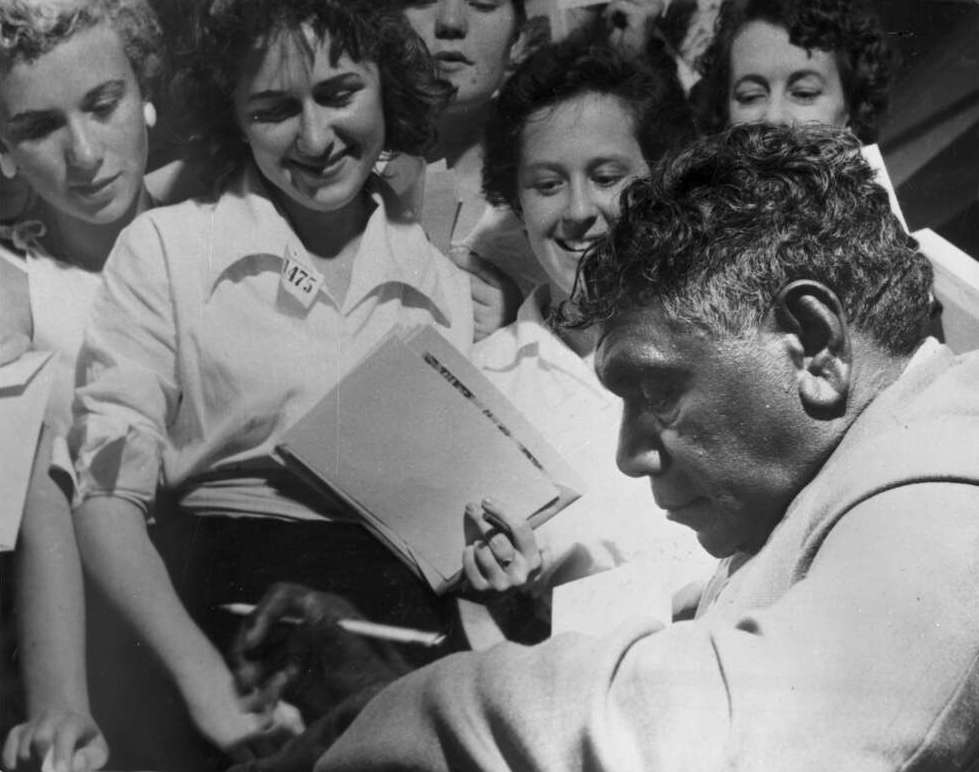 Indigenous Australian artist Albert Namatjira signing autographs.