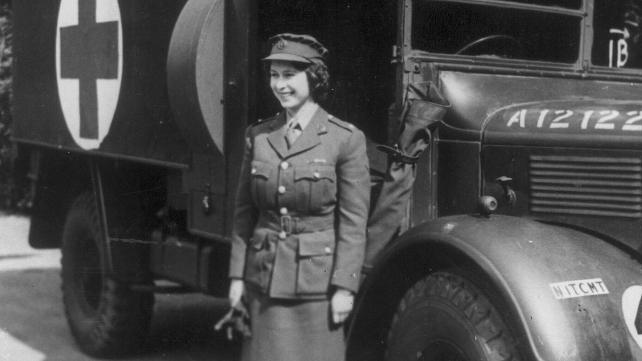 The then Princess Elizabeth standing in front of an army truck during World War II, in which she served as a mechanic.