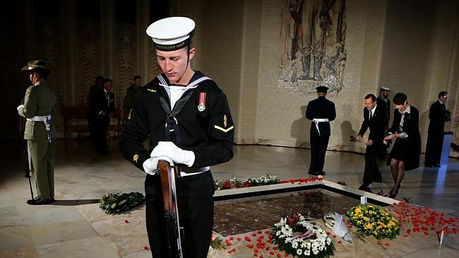 Tony Abbott and his wife Margie lay floral tributes at the Tomb of The Unknown Soldier on Anzac Day 2013 at the Australian War Memorial in Canberra.