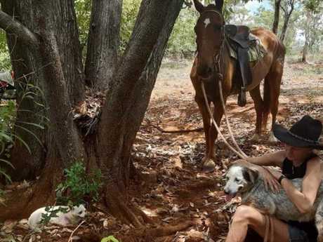 At home in the bush … Lee Hodgkin taking a break with her horse and dogs.
