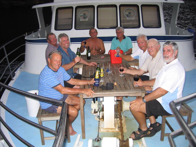 Malcolm Reid with friends on his 60-foot charter boat The Island Explorer - it was “his pride and joy and the bane of his existence all at one," says his son Mark.