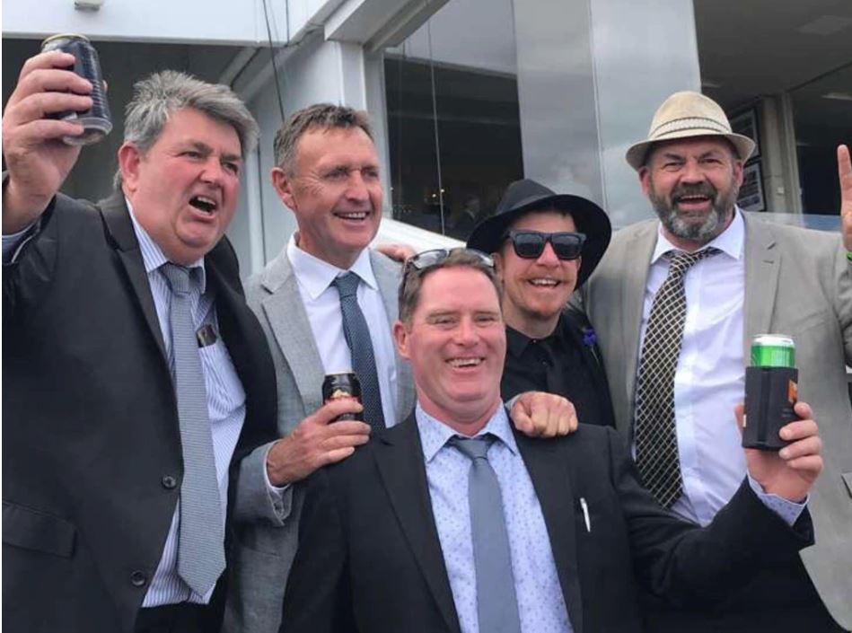 Sam Flanders, far right, on Derby Day at Flemington Race Course with his punters club mates, from left: Shane, Dave, Webby and Danny Lannen.
