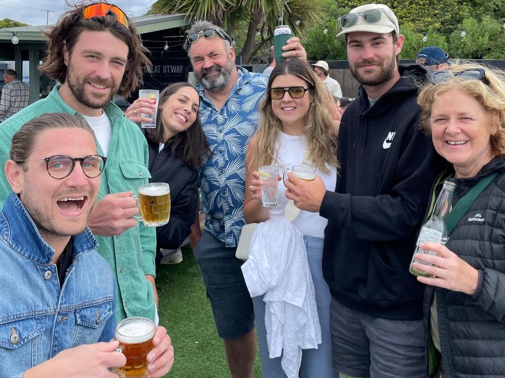 Holiday fun … Sam at his favourite drinking spot, the Lorne Aquatic and Angling Club, with, from left: Andreas Boehler, son Willis Flanders, Grace Withers, daughter Gemma Flanders, James Flanders and Cindy Flanders