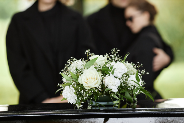 What is the funeral attire for women and men to pay respects