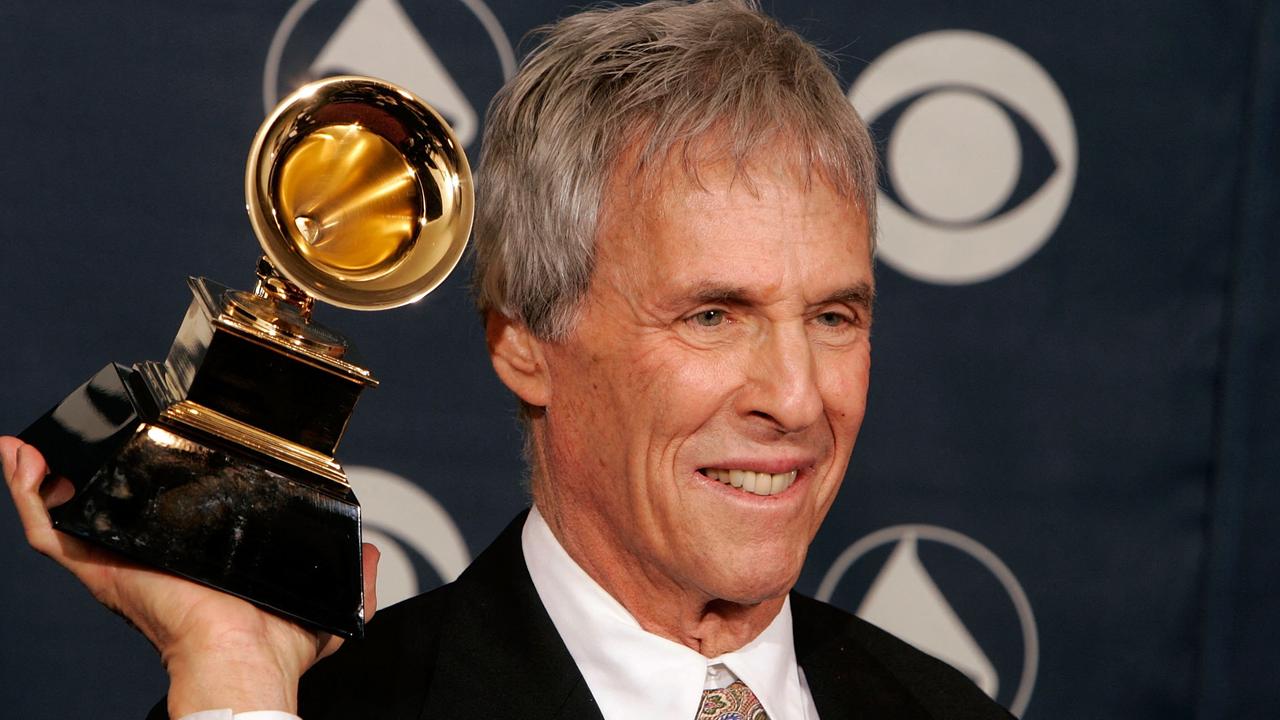 In 2006, Burt Bacharach poses with his award for Best Pop Instrumental Album in the press room at the 48th Annual Grammy Awards in Los Angeles, California. (Photo by Kevin Winter / GETTY IMAGES NORTH AMERICA / AFP)