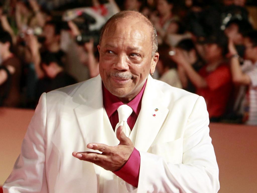 Multi-Grammy winning musician Quincy Jones gestures on the red carpet prior to the closing ceremony of the 12th Shanghai International Film Festival in 2009