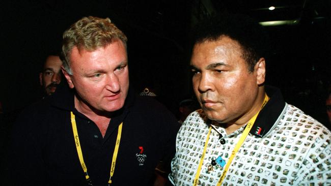 Joe Bugner of Australia (left) and Muhammad Ali. Credit: Mike Hewitt/ALLSPORT/getty
